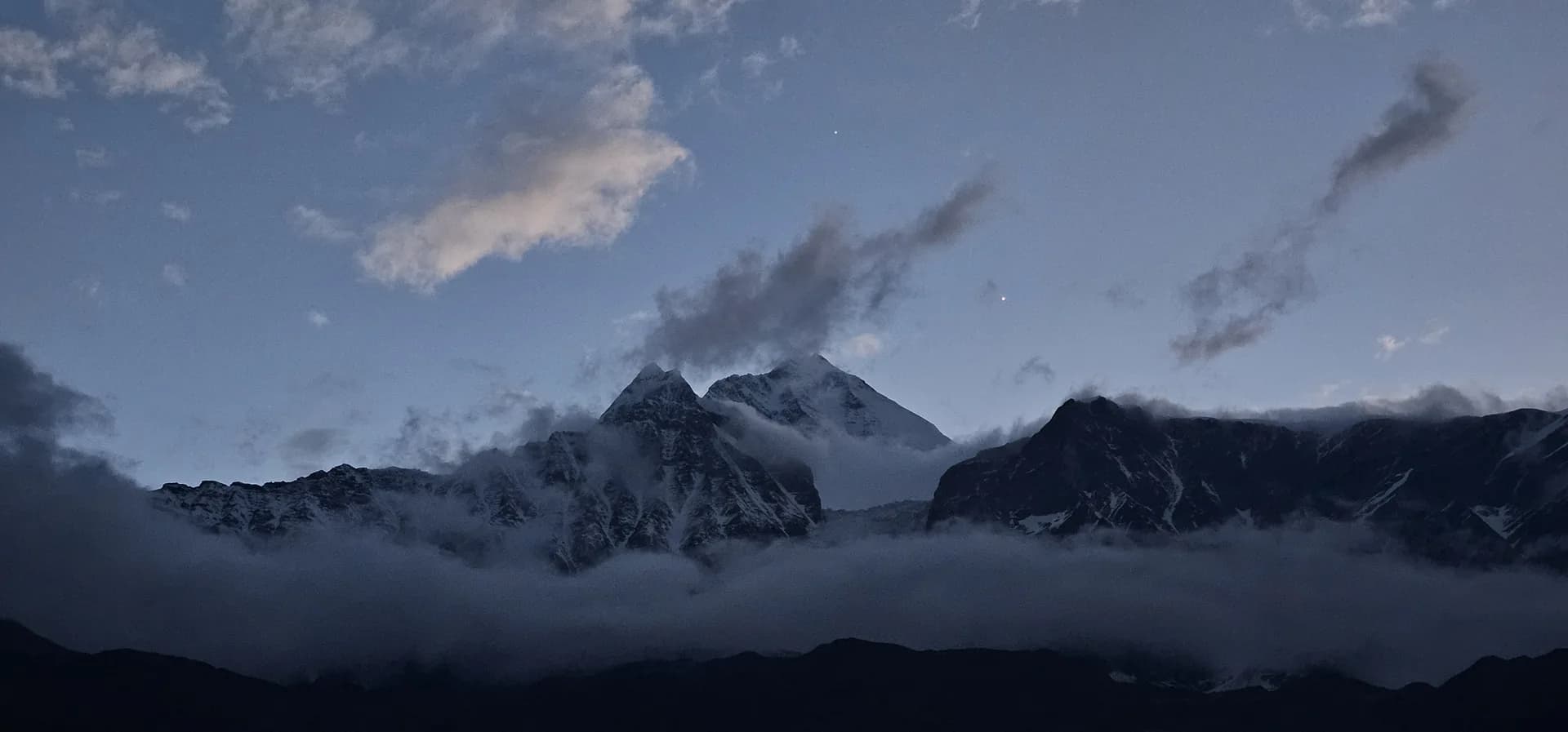 Himalayan peaks breaking through low cloud