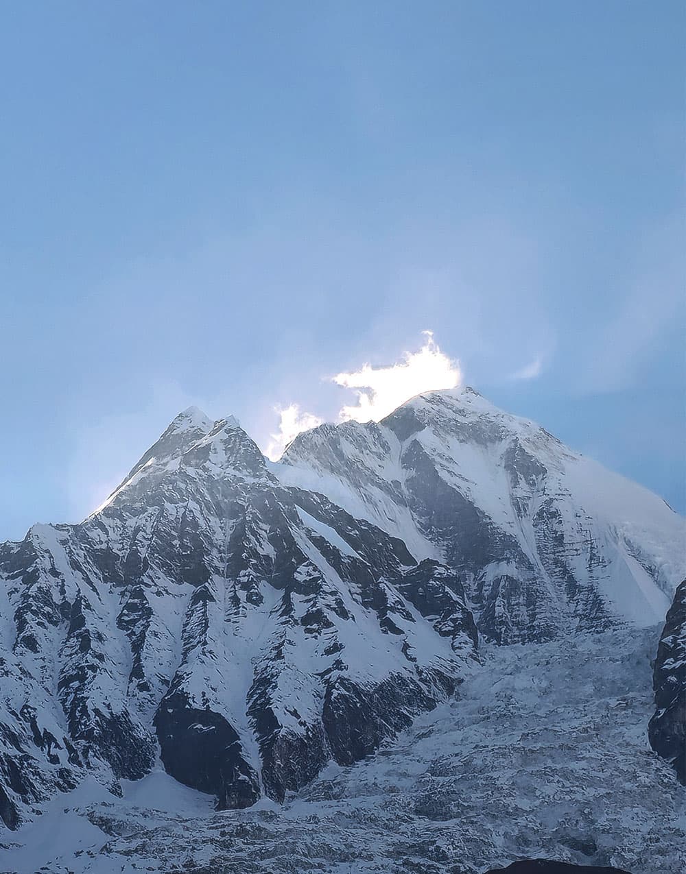 Snow-capped Himalayan peak with spindrift blowing off the summit
