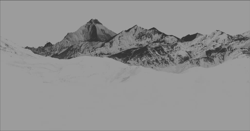 Carved festival mask held against the mountain backdrop