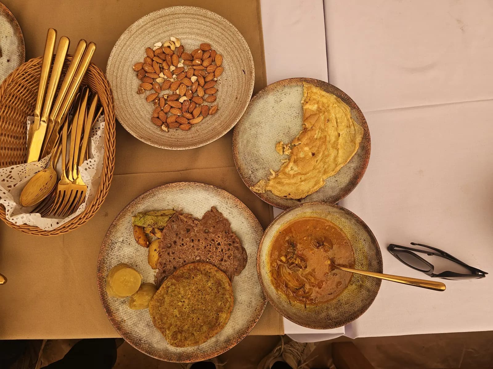 Brass singing bowls set out for a sound healing session